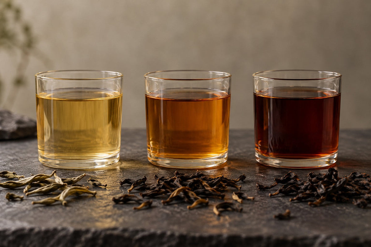 Three tea infusions ranging from pale gold to dark amber