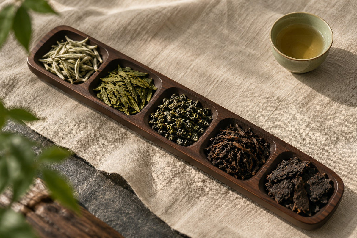Five contrasting tea samples in a divided walnut tea scoop