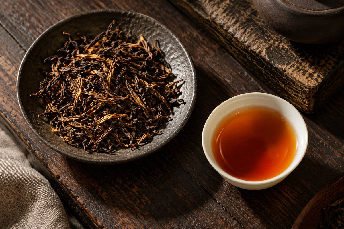 Twisted red tea leaves with golden tips and copper coloured infusion