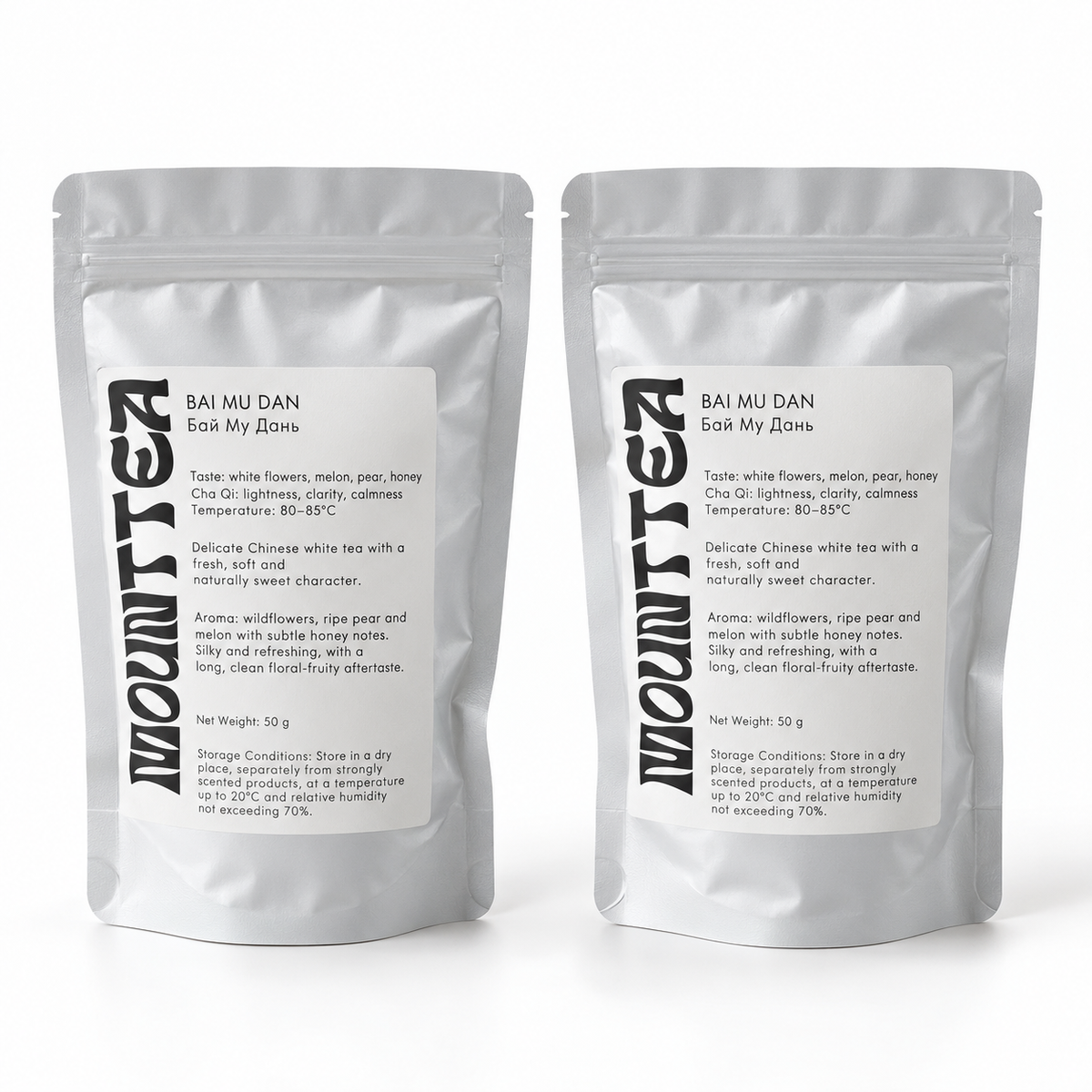 Two MOUNTTEA Bai Mu Dan white tea pouches on a white background