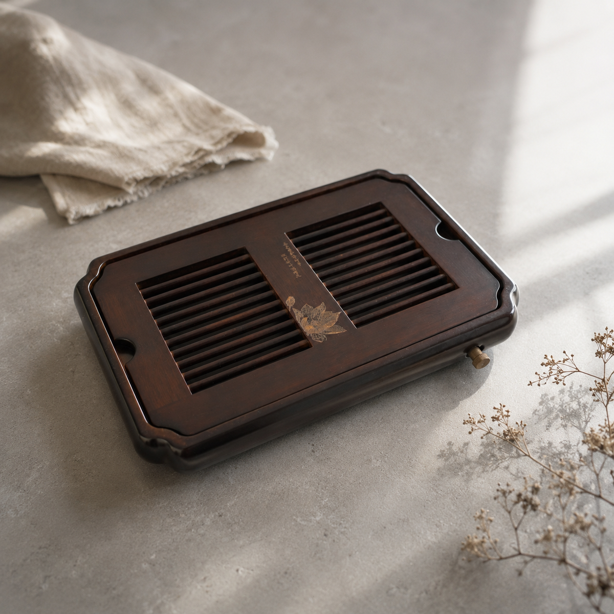Dark Bamboo Lotus tea tray on a light tabletop