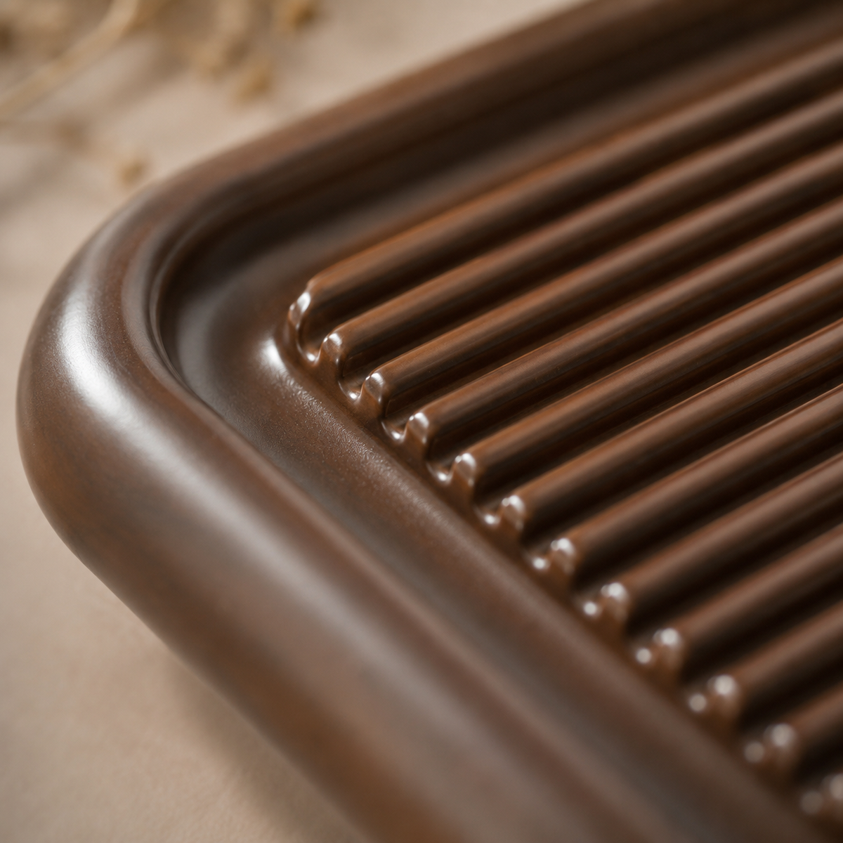 Close-up of the rounded frame and slats of the Chaban tea tray