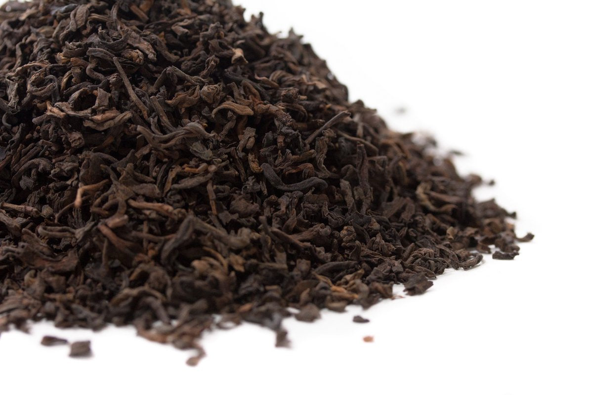 Macao Chen Nian aged Pu-erh with camphor wood resin balsamic nut and forest notes