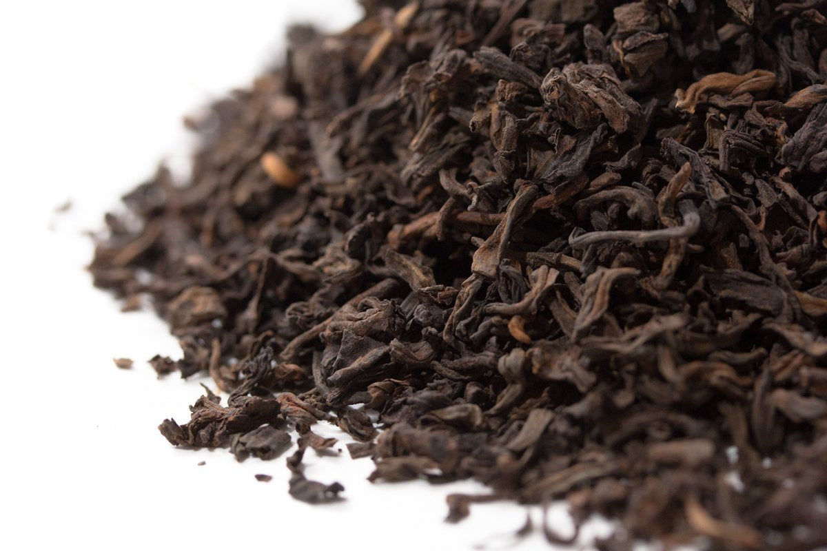 Close-up of loose Macao Chen Nian aged Pu-erh leaves