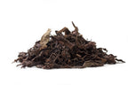 Big Panda aged ripe Pu-erh leaves on a white background