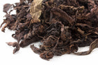 Close-up of whole leaves and stems in Big Panda Pu-erh tea