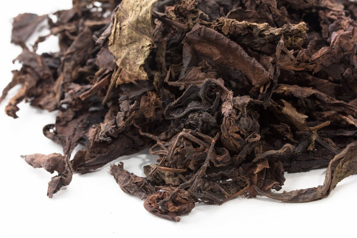 Close-up of whole leaves and stems in Big Panda Pu-erh tea