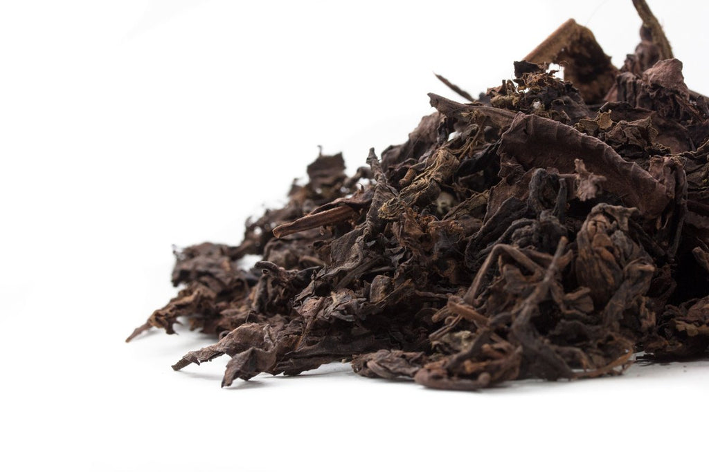 Side view of a pile of Big Panda aged Pu-erh leaves