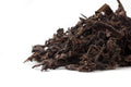 Side view of a pile of Big Panda aged Pu-erh leaves